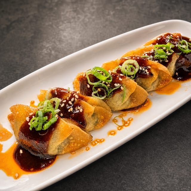 G. Miso Glazed Gyoza.